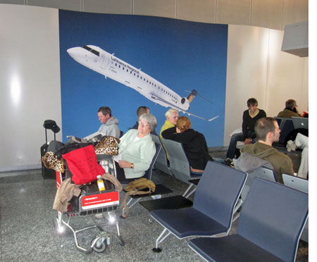 Chillin' at Gate A46 and guarding my red bag