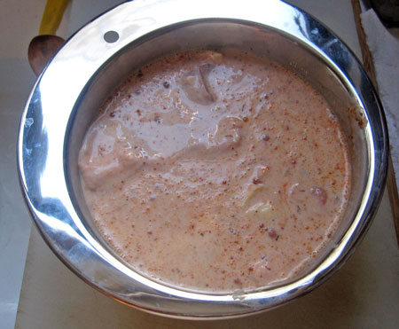 chicken marinating in buttermilk mixture
