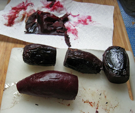 peel with a paper towel... with luck, the skin will come off in one piece