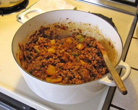add your beef and brown, add your sausage and brown, stir into the vegetables
