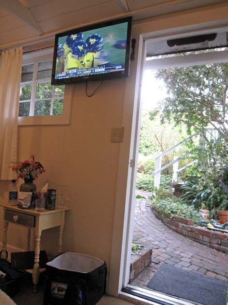 our room at the inn, nice room... saturday football on the tv... beside me, the bed is just a bed