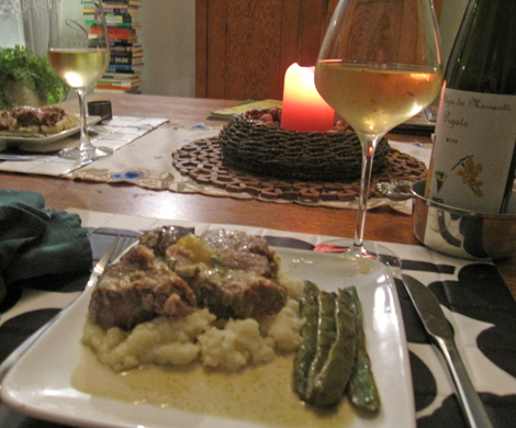 pork served with mashed potatoes and Romano beans.