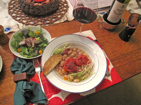 sardine with tomato salad served alongside beans and tomatoes